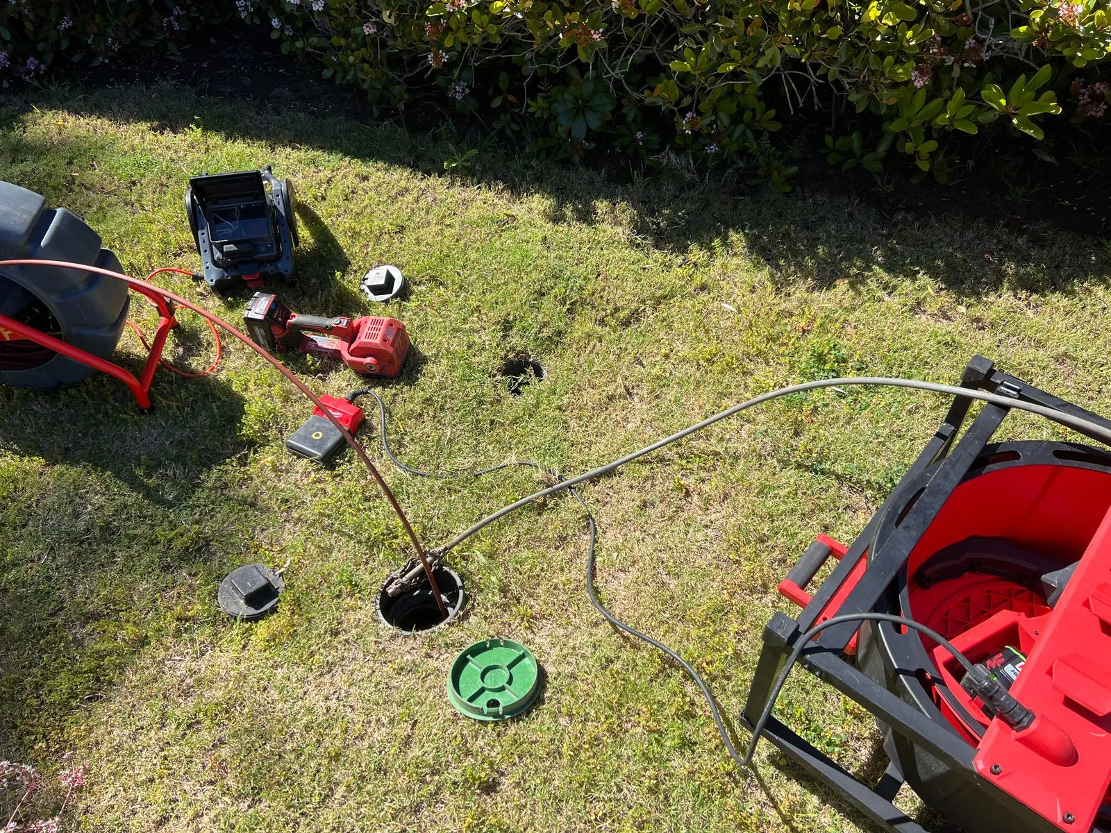 Drain cleaning in progress at a San Diego County home — cleanout access with sewer machine